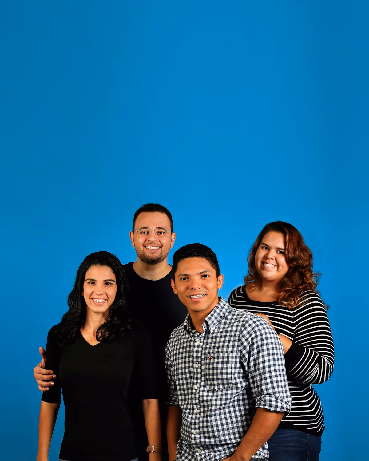 A diverse, friendly group of support professionals smiling together