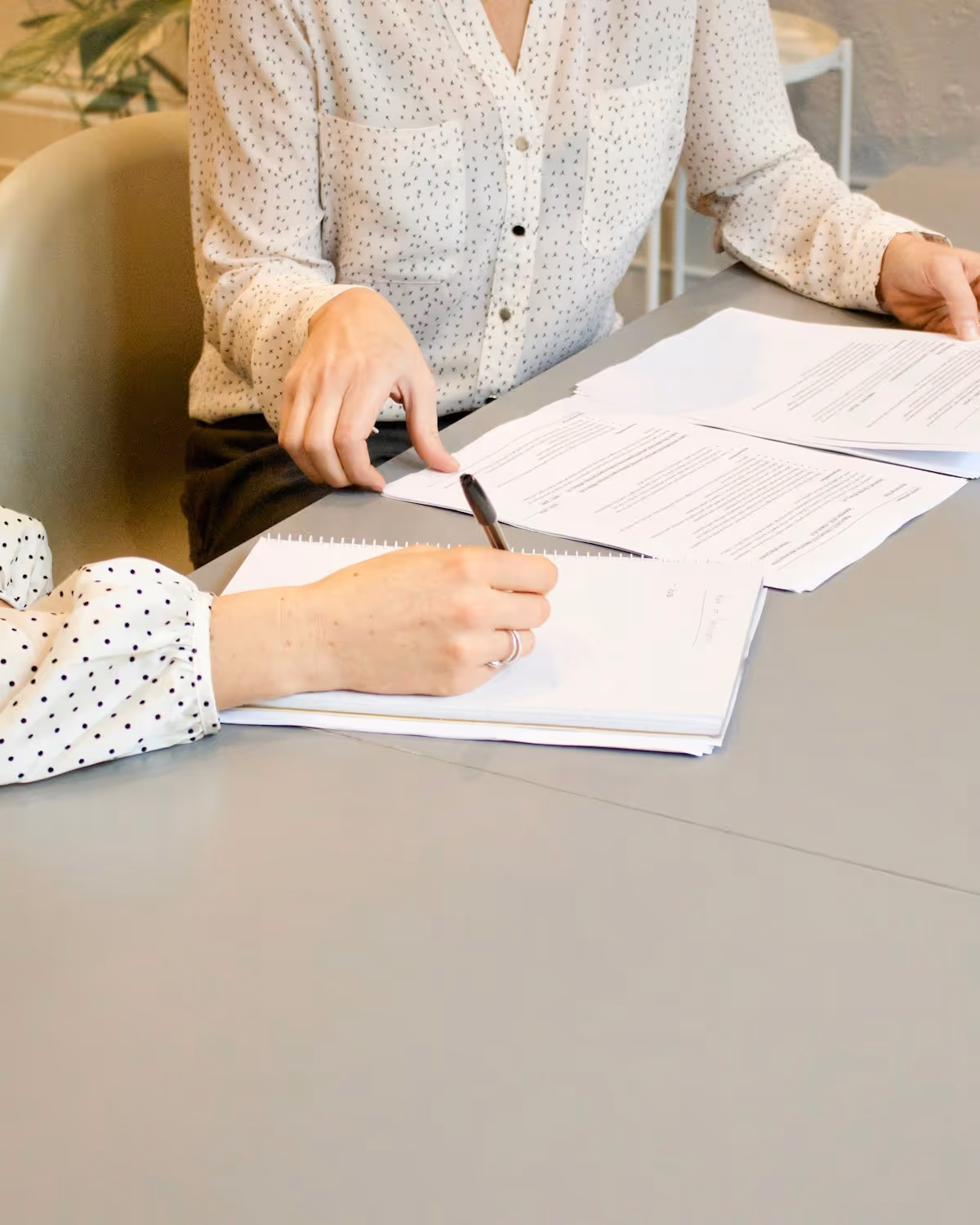 A person reviewing paperwork while planning their NDIS supports