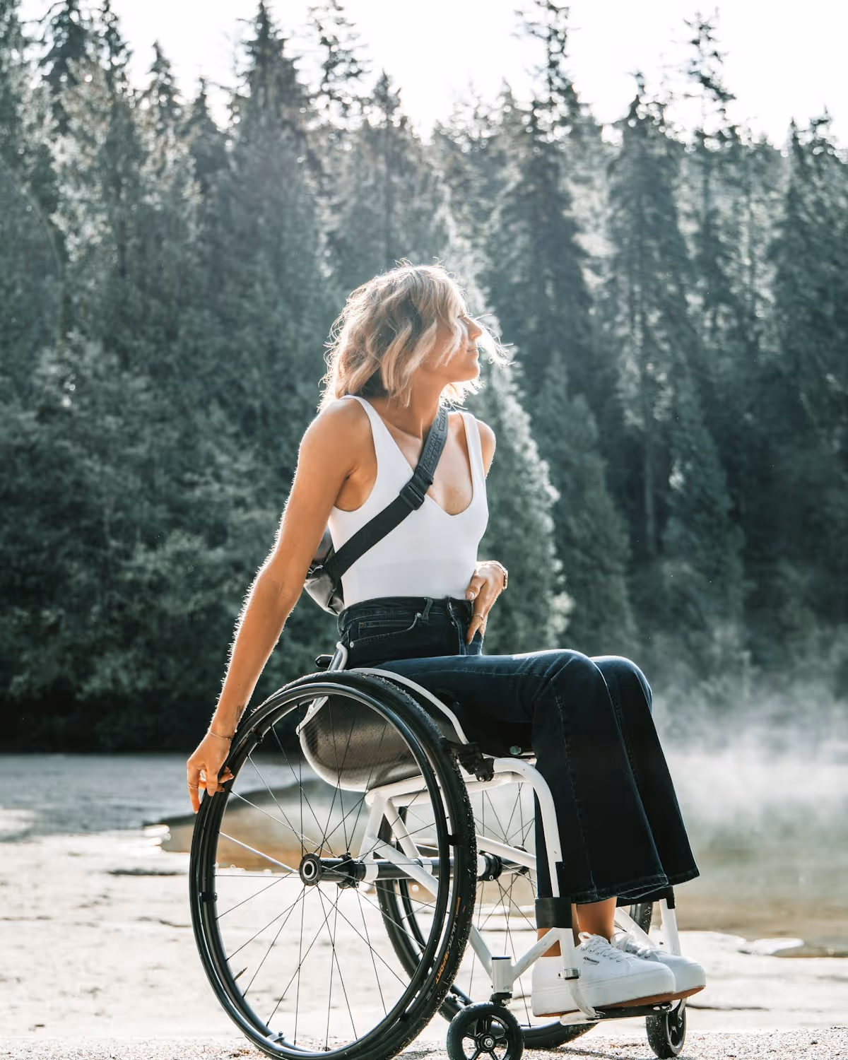 A person using a wheelchair enjoying the outdoors on a bright day