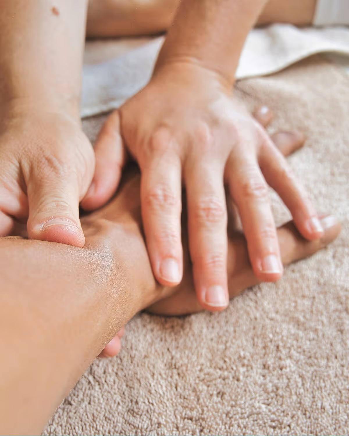 An occupational therapist guiding a gentle hand-strengthening exercise